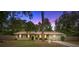 Charming one-story home featuring a well-maintained lawn and mature trees, creating a welcoming curb appeal at 3331 Se 4Th St, Ocala, FL 34471