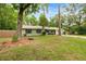 Charming home with a well-manicured lawn and mature trees offering privacy and a serene setting at 3331 Se 4Th St, Ocala, FL 34471