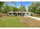 Charming single-story home features a well-maintained front yard with a lovely green facade at 3331 Se 4Th St, Ocala, FL 34471