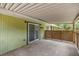 A covered patio with sliding glass doors and lattice features at 3331 Se 4Th St, Ocala, FL 34471
