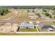 Aerial view of house with gray roof, fenced backyard, and view of neighborhood and surrounding community at 3418 Sw 155Th Pl, Ocala, FL 34473