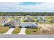 Aerial view of a residential neighborhood showcasing well-maintained homes, green lawns, and mature trees at 3418 Sw 155Th Pl, Ocala, FL 34473