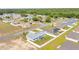 Aerial view of house and neighborhood, showing lush green trees and well-maintained lawns at 3418 Sw 155Th Pl, Ocala, FL 34473
