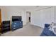 Bedroom showcasing a closet, dresser, and comfortable blue sofa, creating a cozy retreat at 3418 Sw 155Th Pl, Ocala, FL 34473