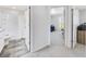 Hallway view showcasing the connection between the bathroom and another room, offering a sense of flow at 3418 Sw 155Th Pl, Ocala, FL 34473