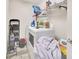 Functional laundry room equipped with a washer, dryer, and storage for efficient household tasks at 3418 Sw 155Th Pl, Ocala, FL 34473