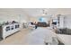 Bright living room featuring neutral walls, carpet floors, ceiling fan, and natural light at 3418 Sw 155Th Pl, Ocala, FL 34473