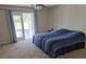 Bright bedroom with French doors leading to the outside and carpet flooring at 360 Marion Oaks Golf Way, Ocala, FL 34473