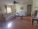 Bright living room with wood floors and lots of comfortable furniture at 360 Marion Oaks Golf Way, Ocala, FL 34473