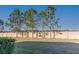 Landscaped backyard featuring a privacy fence and mature trees at 3947 Nw 46Th Ter, Ocala, FL 34482