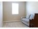 This carpeted bedroom features a large window and comfortable furniture at 3947 Nw 46Th Ter, Ocala, FL 34482