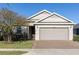 Charming single-story home featuring a two-car garage and manicured front lawn with a brick-paved driveway at 3947 Nw 46Th Ter, Ocala, FL 34482