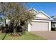 Charming single-story home featuring a two-car garage and manicured front lawn with a brick-paved driveway at 3947 Nw 46Th Ter, Ocala, FL 34482