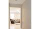View of a hallway looking into the living room with neutral paint and tile floors at 3947 Nw 46Th Ter, Ocala, FL 34482