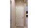 This hallway features a door leading to another room and neutral colored walls at 3947 Nw 46Th Ter, Ocala, FL 34482
