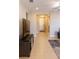 View down the hallway towards the front door and into the open living room area at 3947 Nw 46Th Ter, Ocala, FL 34482