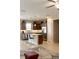 A shot of the kitchen, with stainless steel appliances, an island, and dark brown cabinetry at 3947 Nw 46Th Ter, Ocala, FL 34482