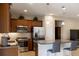 Bright kitchen features stainless steel appliances, granite countertops, and breakfast bar seating at 3947 Nw 46Th Ter, Ocala, FL 34482