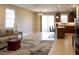 Open living space with kitchen island, sliding doors, and neutral paint at 3947 Nw 46Th Ter, Ocala, FL 34482