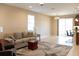 Open living space with kitchen island, sliding doors, and neutral paint at 3947 Nw 46Th Ter, Ocala, FL 34482
