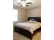 Cozy bedroom featuring a ceiling fan and a large bed with storage drawers underneath at 3947 Nw 46Th Ter, Ocala, FL 34482