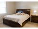 Cozy bedroom featuring a ceiling fan and a large bed with storage drawers underneath at 3947 Nw 46Th Ter, Ocala, FL 34482