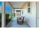 Covered outdoor patio with comfortable seating and views of the backyard at 3947 Nw 46Th Ter, Ocala, FL 34482
