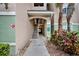 Exterior shot of building entrance with stairway and landscaping at 4897 Cypress Wood Dr # 6313, Orlando, FL 32811