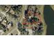 Aerial view of a home in a neighborhood setting, surrounded by trees, with the property outlined in red at 519 Spring Lake Rd, Ocala, FL 34472