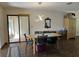 Dining room featuring modern light fixture and access to the outdoor patio at 519 Spring Lake Rd, Ocala, FL 34472