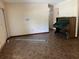 Open living space with tile flooring, piano, and plenty of natural light at 519 Spring Lake Rd, Ocala, FL 34472