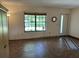 Inviting living room featuring neutral walls, tile flooring and a bright window at 519 Spring Lake Rd, Ocala, FL 34472