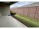 Landscaped backyard with green grass, a privacy fence, and tidy shrubs at 5255 Nw 33Rd Pl, Ocala, FL 34482