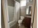 Bathroom features a shower tub combo, granite countertop vanity and tile floors at 5255 Nw 33Rd Pl, Ocala, FL 34482