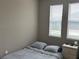 Cozy bedroom features two windows and neutral paint at 5255 Nw 33Rd Pl, Ocala, FL 34482