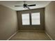 An empty bedroom with neutral walls, carpet, and a ceiling fan at 5255 Nw 33Rd Pl, Ocala, FL 34482