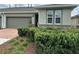Charming home with a well-manicured lawn and a two-car garage, offering curb appeal and convenience at 5255 Nw 33Rd Pl, Ocala, FL 34482
