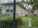 Home exterior with lush landscaping, showcasing the property's curb appeal and outdoor space at 5255 Nw 33Rd Pl, Ocala, FL 34482