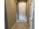 Hallway with tile flooring and neutral paint, creating a seamless transition between living spaces at 5255 Nw 33Rd Pl, Ocala, FL 34482