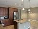 Kitchen featuring stainless steel appliances, granite countertops, and ample storage, ready for culinary adventures at 5255 Nw 33Rd Pl, Ocala, FL 34482