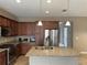 Kitchen featuring stainless steel appliances, granite countertops, and ample storage, ready for culinary adventures at 5255 Nw 33Rd Pl, Ocala, FL 34482