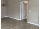 The open living room features neutral colors, tiled floors, modern lighting and easy access to other rooms at 5255 Nw 33Rd Pl, Ocala, FL 34482