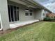 A covered patio with a ceiling fan, providing a perfect outdoor retreat at 5255 Nw 33Rd Pl, Ocala, FL 34482