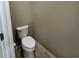 Powder room with a classic white toilet, neutral walls, and tiled floors providing a clean and functional space at 5255 Nw 33Rd Pl, Ocala, FL 34482