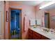 Bathroom featuring a vanity with double sinks, and a walk-in shower at 6190 Sw 84Th Pl, Ocala, FL 34476