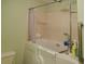 Accessible bathroom featuring a walk-in tub with safety bars and a tiled shower at 6190 Sw 84Th Pl, Ocala, FL 34476