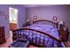 Bedroom with a comfortable bed, side tables, and an en suite bathroom at 6190 Sw 84Th Pl, Ocala, FL 34476