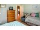 Cozy bedroom featuring an antique dresser and a comfortable twin daybed at 6190 Sw 84Th Pl, Ocala, FL 34476