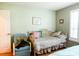 Relaxing bedroom with a charming daybed, chair, and bright natural light at 6190 Sw 84Th Pl, Ocala, FL 34476