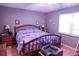 Spacious bedroom with a queen bed, side tables, and closet access at 6190 Sw 84Th Pl, Ocala, FL 34476